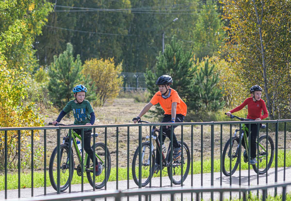Children riding bikes along a path
